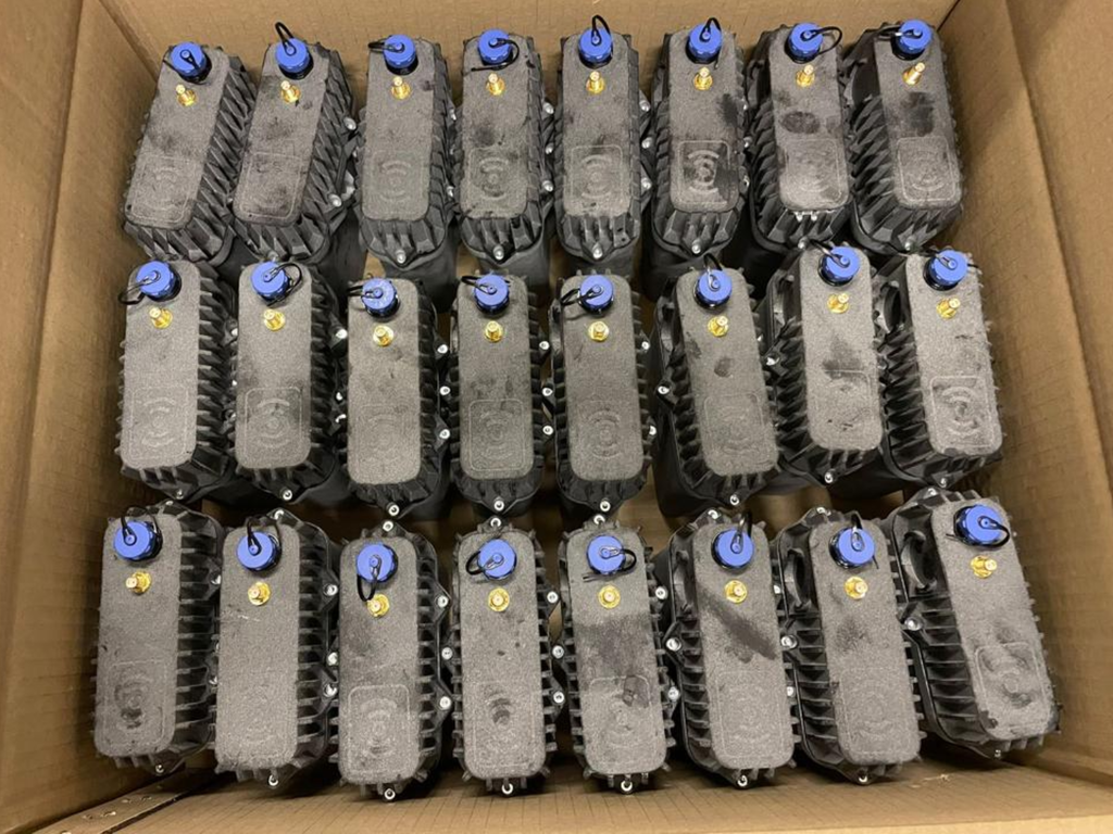 Image of a box of twenty-four assembled UDlive RTUs.