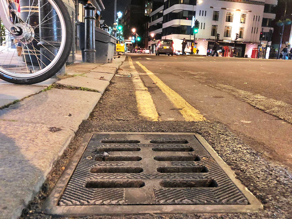 Image of a UDlive Gully Cover installed on a road.